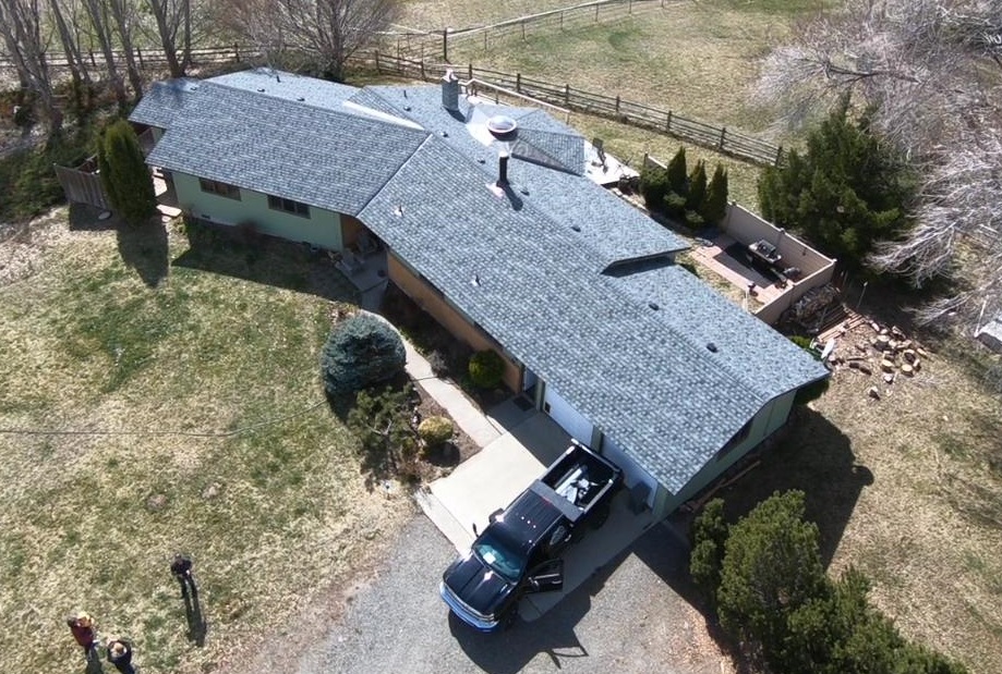 Aerial view of a finished roof on a rural Yakima property